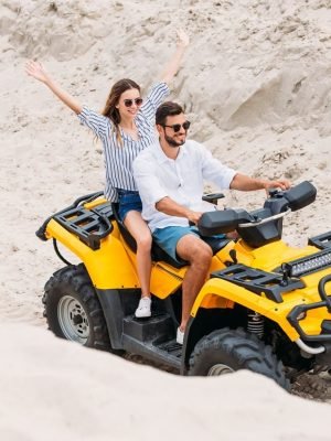 high-angle-view-of-happy-young-couple-riding-atv-i-2024-11-18-15-18-50-utc